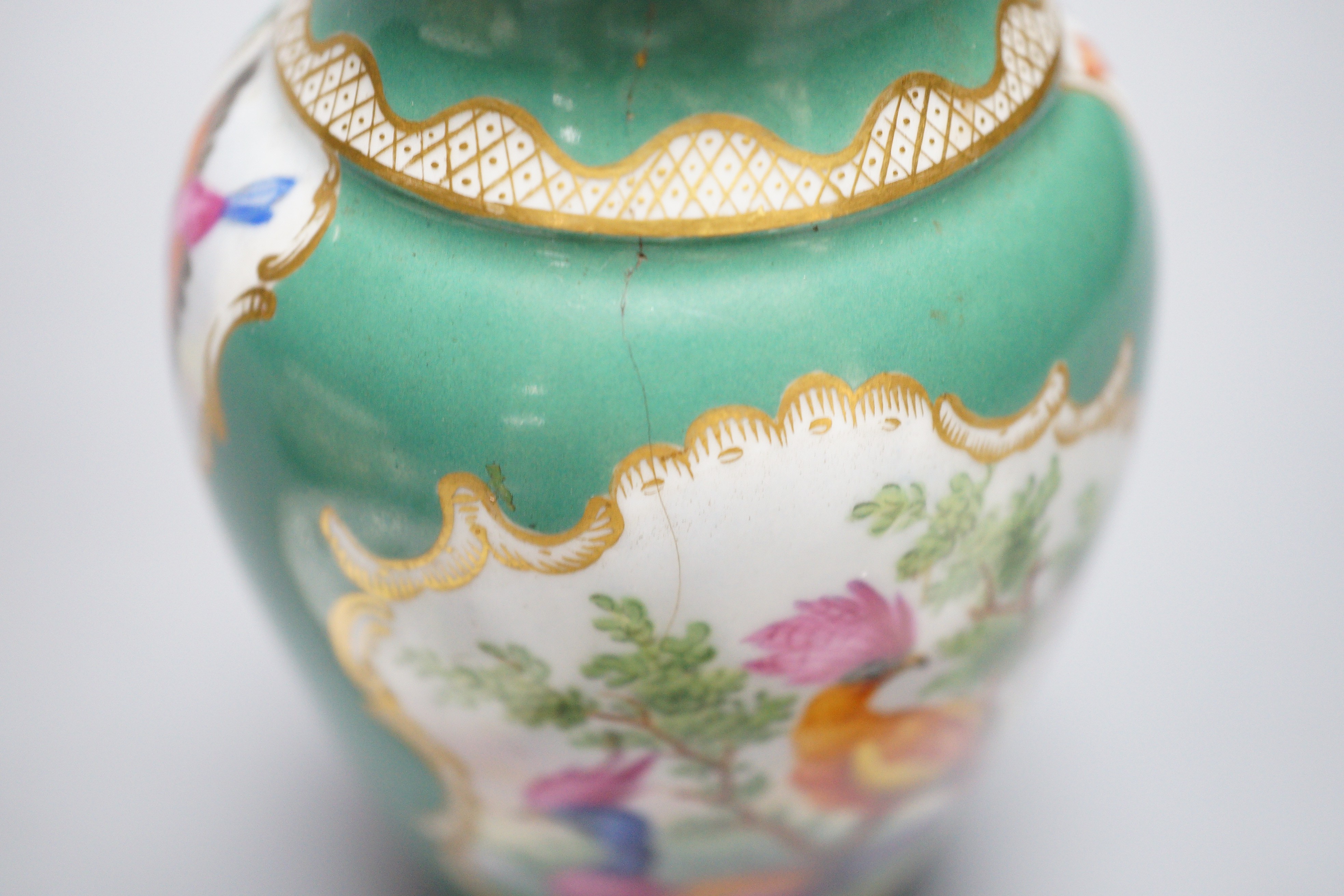 A rare Nyon porcelain slop bowl and saucer, a Meissen saucer and cylindrical pot and a pair of German saucers, red anchor marks